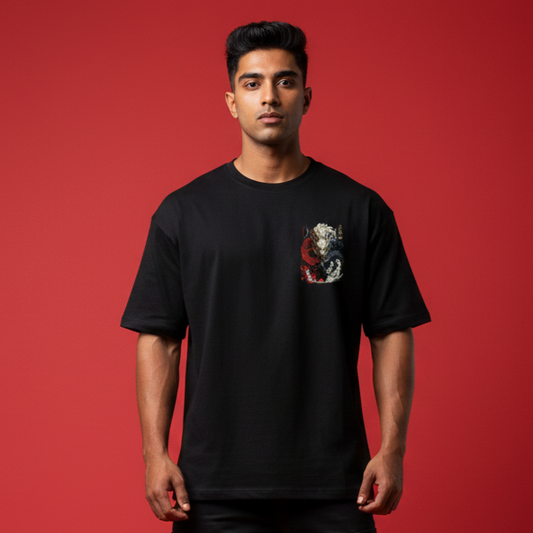 Man wearing a black t-shirt with a graphic design on a red background