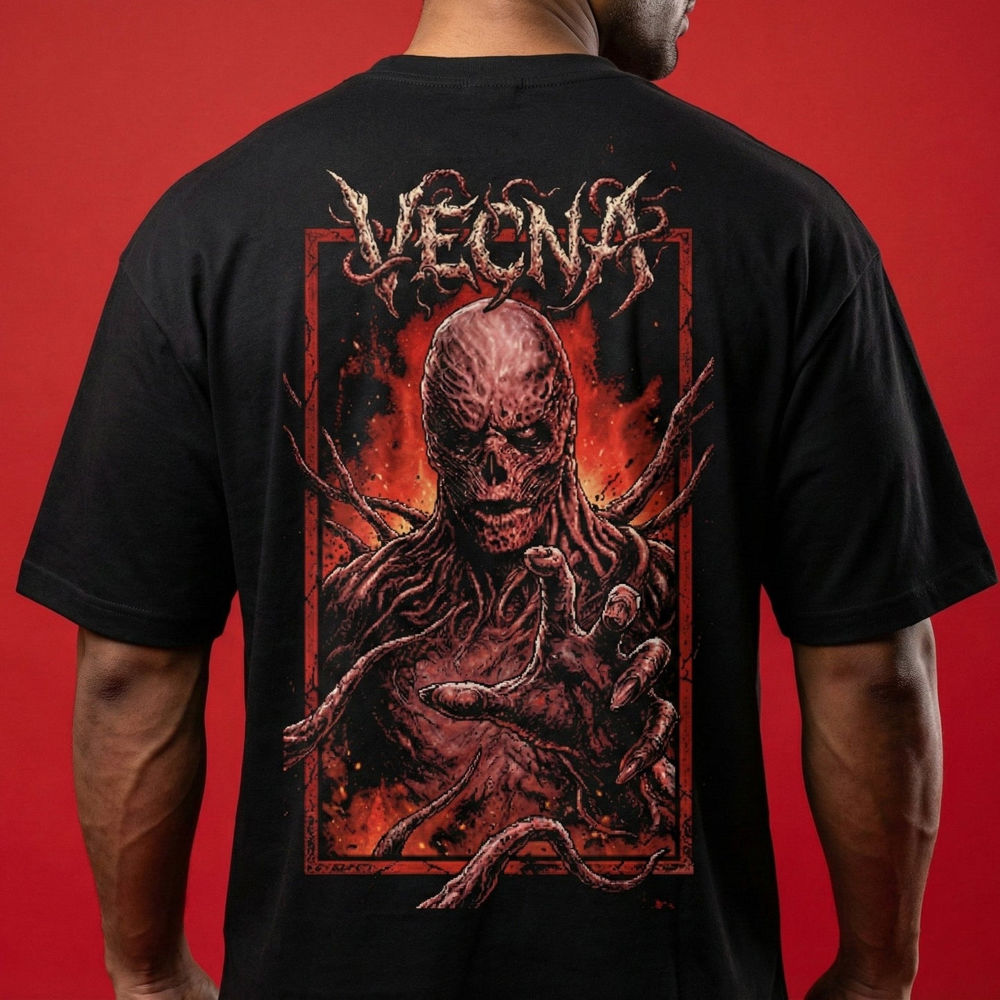 Black t-shirt with a graphic design on the back against a red background