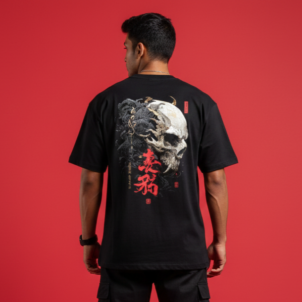 Person wearing a black t-shirt with a graphic design on the back against a red background, skull tshirt