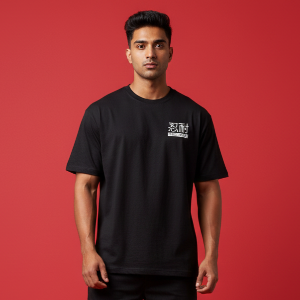 Man wearing a black t-shirt with white text on a red background