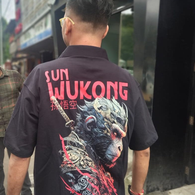 Person wearing a black shirt with 'Sun Wukong' design and text.