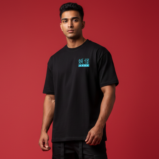 Man wearing a black t-shirt with blue text on a red background